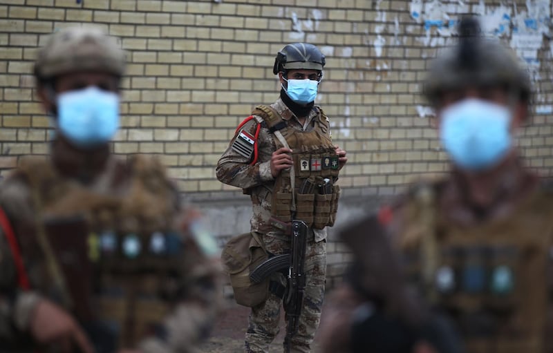 Soldiers deploy in the streets of Baghdad after the capital and some areas of the country imposed a week's curfew. AFP