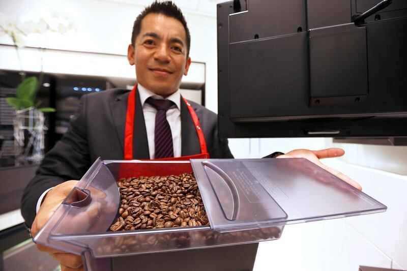 Madhu Kshetri of Miele Gallery shows the beans destined for this Dh17,000  coffee system. Pawan Singh / The National
