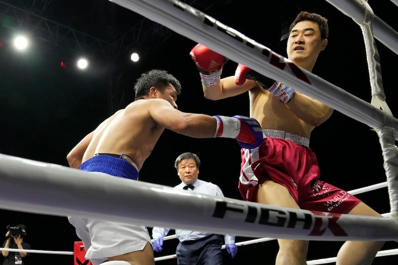 Manny Pacquiao lands a punch on DK Yoo during the third round of their exhibition bout. AP