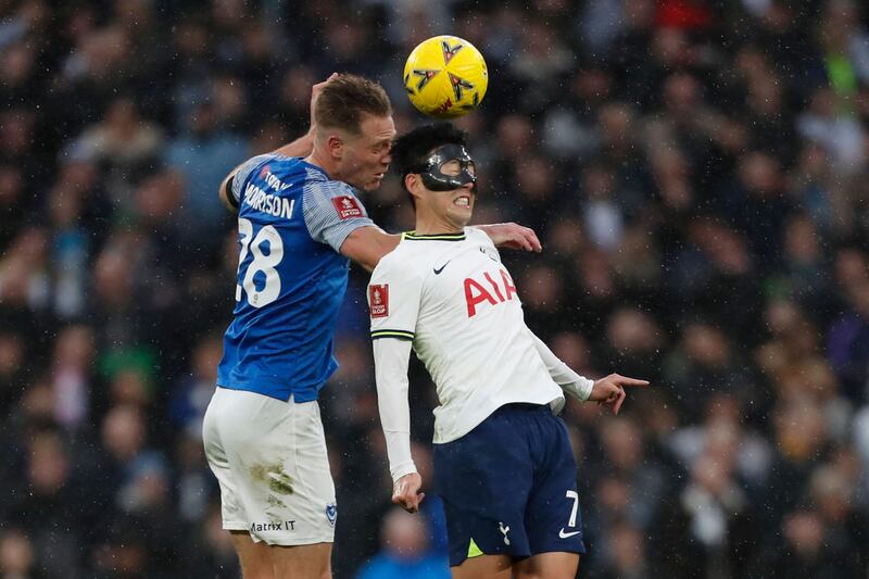 Portsmouth defender Michael Morrison battles with Tottenham striker Son Heung-Min. AFP