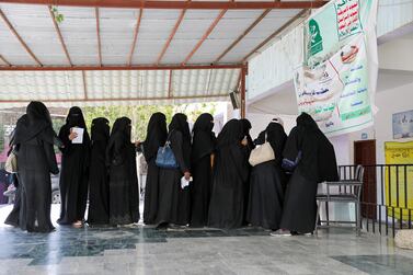 Women queue for food vouchers at a World Food Programme food aid distribution centre in Sanaa, Yemen's rebel-held capital, on February 11, 2020. Reuters