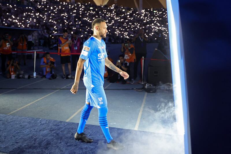 Brazilian superstar Neymar enters the pitch during his unveiling at Al Hilal in Riyadh on Saturday, August 19, 2023. AFP