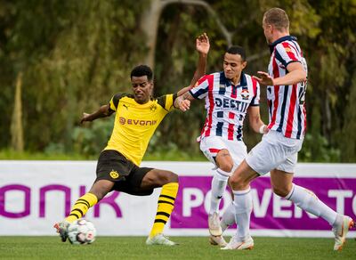 A young Alexander Isak, left, in action for Borussia Dortmund during a friendly match against Willem II, the Dutch club he'd later join on loan. Getty