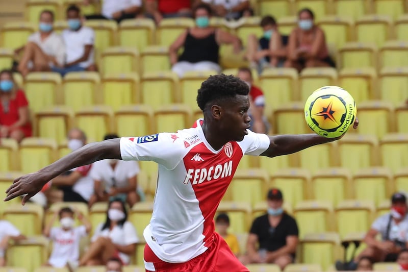 Monaco's French defender Benoit Badiashile controls the ball as he prepares to score a goal during the French L1 football match between AS Monaco and Stade de Reims at The "Louis II Stadium" in Monaco on August 23, 2020. (Photo by Valery HACHE / AFP)