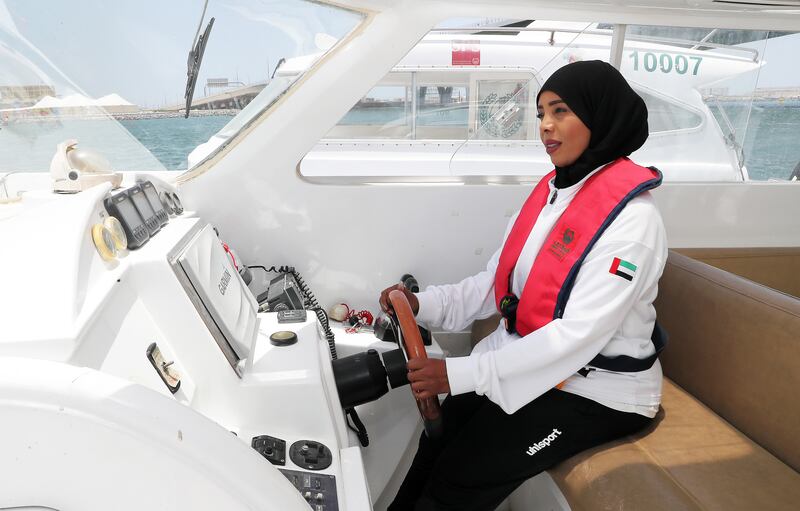 Maj Al Dhaheri at the controls of a rescue boat in Deira, Dubai. Pawan Singh / The National