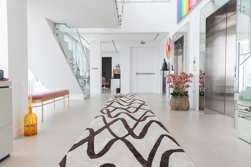 A monochrome runner by Cinar Rugs is placed at the entrance. Antonie Robertson / The National