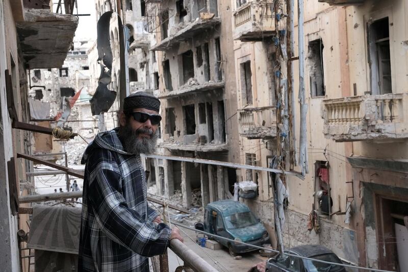 Jamal Faraj Al Mellah, 60, stands on a damaged balcony at home, in Benghazi, Libya October 26, 2020. Picture taken October 26, 2020. REUTERS/Esam Omran Al-Fetori