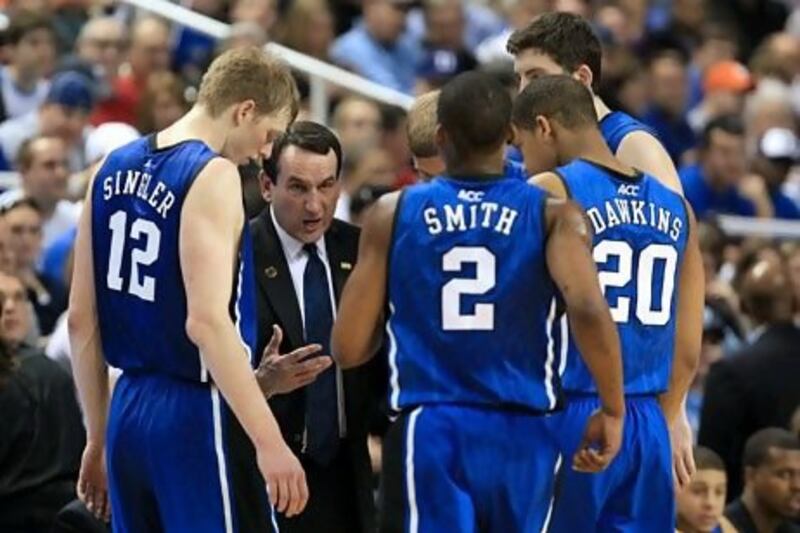 Business leaders can learn from Mike Krzyzewski, second left, the coach of the Duke Blue Devils basketball team. Streeter Lecka / AFP