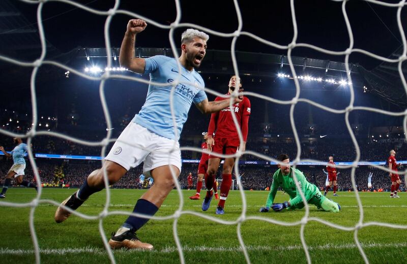 Manchester City's Sergio Aguero celebrates their second goal scored by Leroy Sane. Reuters