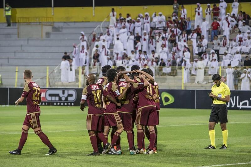 Al Wahda players celebrate scoring their first goal in the 6-0 victory over Al Jazira in the President's Cup quarter-final at the Zabeel Stadium in Dubai. Antonie Robertson / The National