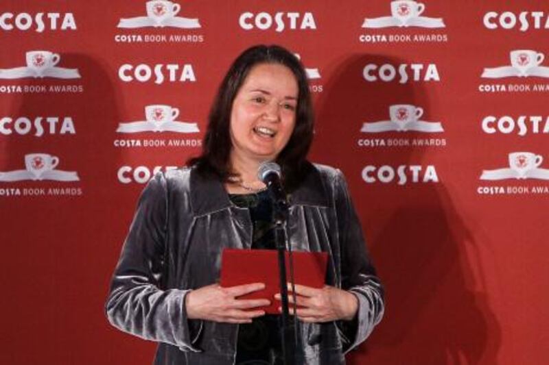 Winner of the Costa Book of the Year Award Jo Shapcott reacts after winning the award in London Tuesday, Jan., 25, 2011. A book of poetry inspired in part by the writer's experience of breast cancer was hailed as "a celebration of life" tonight as it carried off a major literary prize. Shapcott's surprise victory for her book, Of Mutability, makes it two years in a row that poetry has won the Costa Book Award. (AP Photo/Alastair Grant) *** Local Caption ***  XAG109_Britain_Book_Awards.jpg