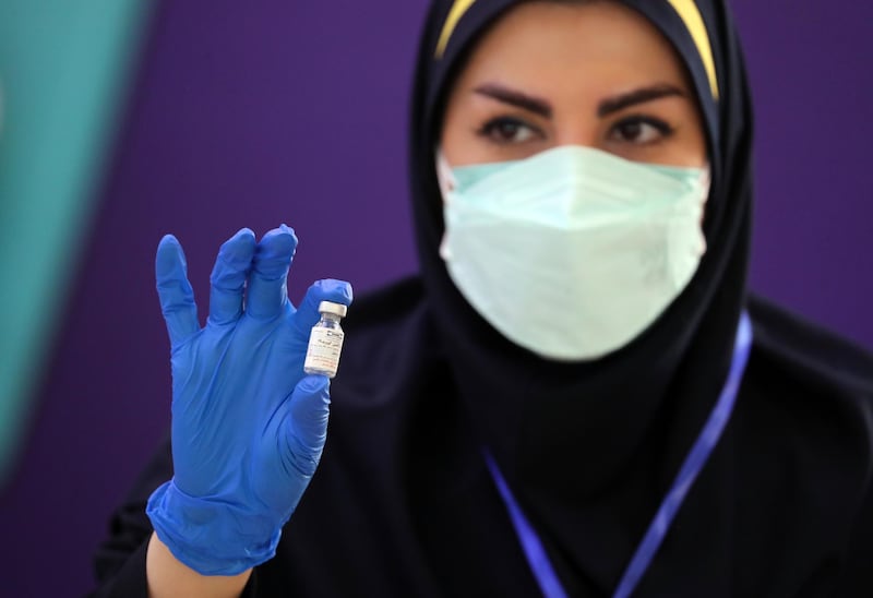 epa09157853 An Iranian health worker shows a dose of the locally-made 'COVIRAN Barekat' at the beginning of the third phases of the human test of the vaccine, in Tehran, Iran, 25 April 2021. Phases three of clinical trials of the locally-made COVID-19 vaccine began on 25 March, after the second phase of human trials took place on 15 March. According to Mohammad Mokhber, the head of COVIRAN Barekat vaccine department, the vaccine will be ready in summer 2021 for massive vaccination in Iran.  EPA-EFE/ABEDIN TAHERKENAREH