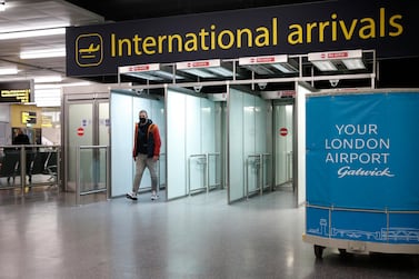 A traveller arrives at Gatwick Airport south of London, ahead of the start date of the UK's hotel quarantine system. Getty Images