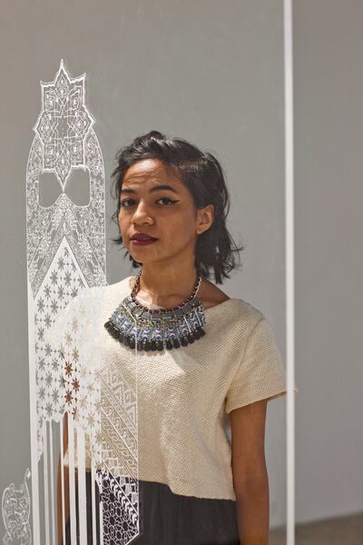 SHARJAH, UNITED ARAB EMIRATES,  JULY 17, 2013. Artist Basmah Felemban with her marker pen on plexiglass art pieces at The Beginning of Thinking is Geometric exhibition at the Maraya Art Centre, Al Qasba in Sharjah. (ANTONIE ROBERTSON / The National) Journalist Anna Seaman *** Local Caption ***  AR_1707_Geometric_Exhibition_Sharjah-24.jpg