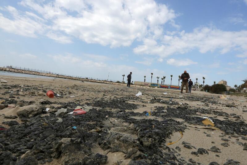 Tar is seen on the beach in the aftermath of an oil spill in the Mediterranean, in Tyre nature reserve, Lebanon. Reuters
