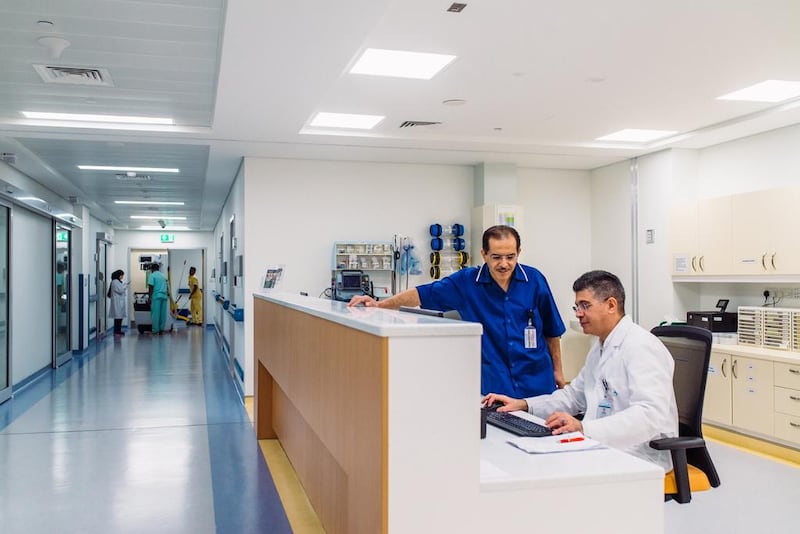 Left, Ahmad Sabbah, a nurse manager, and Jose Salmon, a critical care specialist, in Rashid Hospital in Dubai. The study found that diversity is a positive in the workplace. Alex Atack for The National.