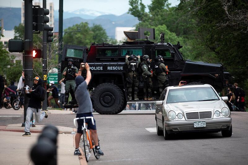 Police are seen as protesters march in Denver, Colorado, US. Reuters