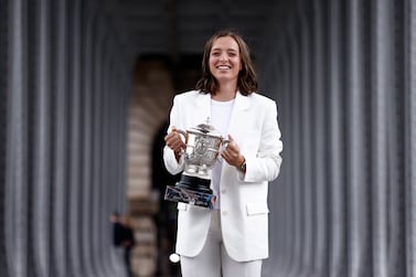 Iga Swiatek of Poland poses with her trophy at Bir Hakeim bridge after winning the womenâ€™s final match against Coco Gauff of the USA at the French Open tennis tournament at Roland â€‹Garros in Paris, France, 05 June 2022.   EPA / YOAN VALAT