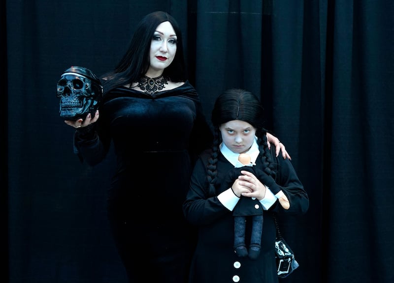 Morticia, left, and Wednesday Addams at New York Comic Con. AFP