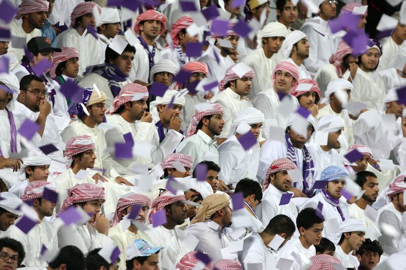 Dubai, United Arab Emirates, Sep 17, 2012 -  Al Ain 's fans celebrate during a match against Al Jazira at  Super Cup final match at Al Wasl Sports Club.  ( Jaime Puebla / The National Newspaper )