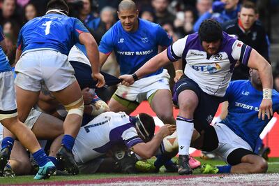 Scotland's hooker Stuart McInally (C) scores a try during the autumn international rugby union test match between Scotland and Samoa at Murrayfield stadium in Edinburgh on November 11, 2017. / AFP PHOTO / ANDY BUCHANAN