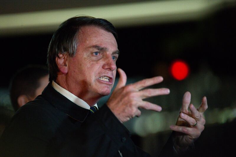 BRASILIA, BRAZIL - MAY 22: President of Brazil Jair Bolsonaro speaks with press about the controversial cabinet meeting video recently disclosed on May at Alvorada Palace on May 22, 2020 in Brasilia. The video's revelation comes in the middle of a Government Crisis in Brazil during the coronavirus (Covid-19) pandemic. (Photo by Andressa Anholete/Getty Images)
