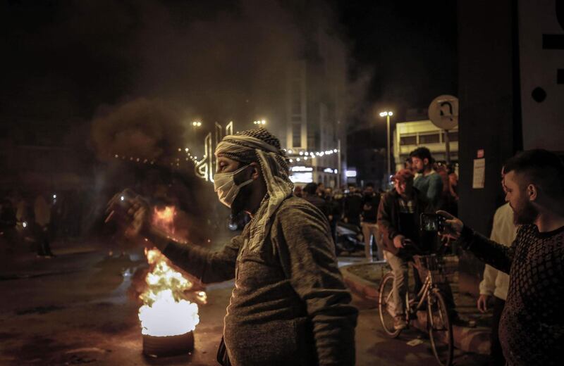 Lebanese people protest in the northern city of Tripoli on April 17, 2020 despite the country's coronavirus lockdown. AFP