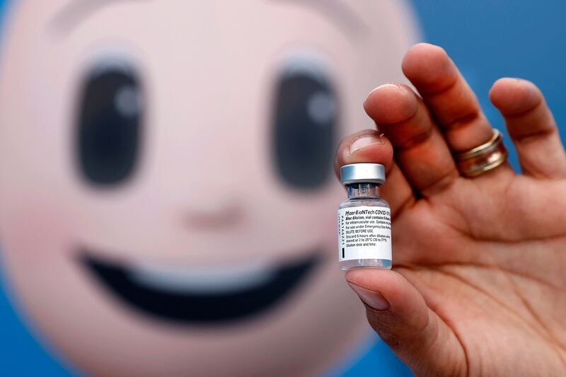 A medic holds a vial of the Pfizer-BioNTech Covid-19 vaccine at a centre in Taibeh, northern Israel. Photo: AFP