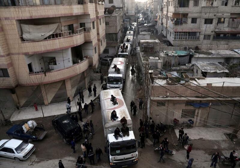 A Red Crescent convoy carrying humanitarian aid arrives in Kafr Batna, in the rebel-held Eastern Ghouta area, on the outskirts of the capital Damascus on February 23, 2016. Amer Almohibany

