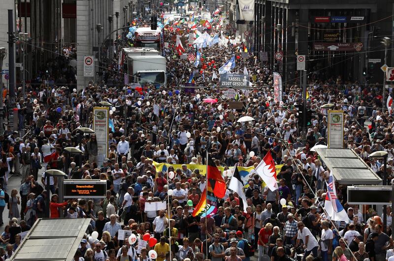 People attend a rally against the government's restrictions following the coronavirus disease (COVID-19) outbreak, in Berlin, Germany, August 29, 2020. REUTERS/Christian Mang