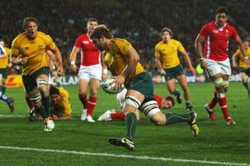 AUCKLAND, NEW ZEALAND - OCTOBER 21:  Ben McCalman of the Wallabies goes over to score his try during the 2011 IRB Rugby World Cup bronze final match between Wales and Australia at Eden Park on October 21, 2011 in Auckland, New Zealand.  (Photo by Cameron Spencer/Getty Images) *** Local Caption ***  129887822.jpg