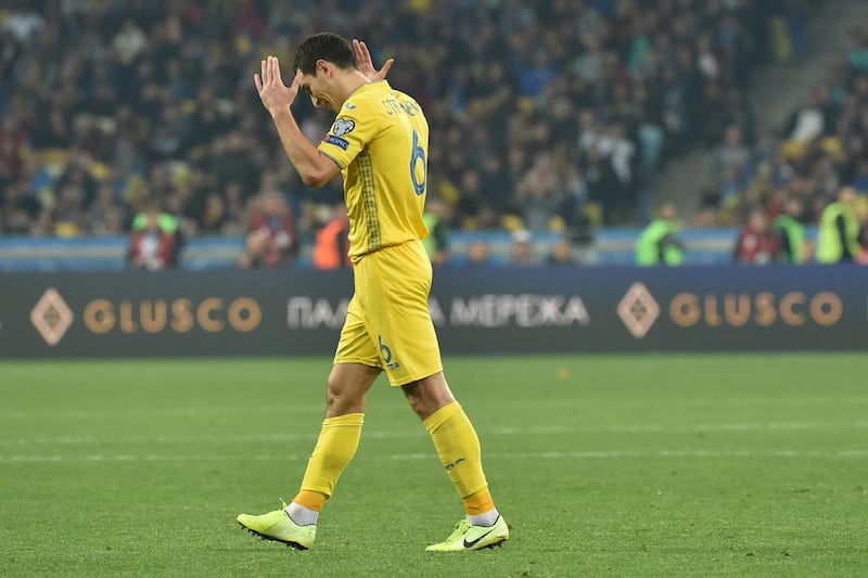 Ukraine's midfielder Taras Stepanenko walks off the pitch after receiving red card during the Euro 2020 football qualification match between Ukraine and Portugal at the NSK Olimpiyskyi stadium in Kiev on October 14, 2019. / AFP / Genya SAVILOV
