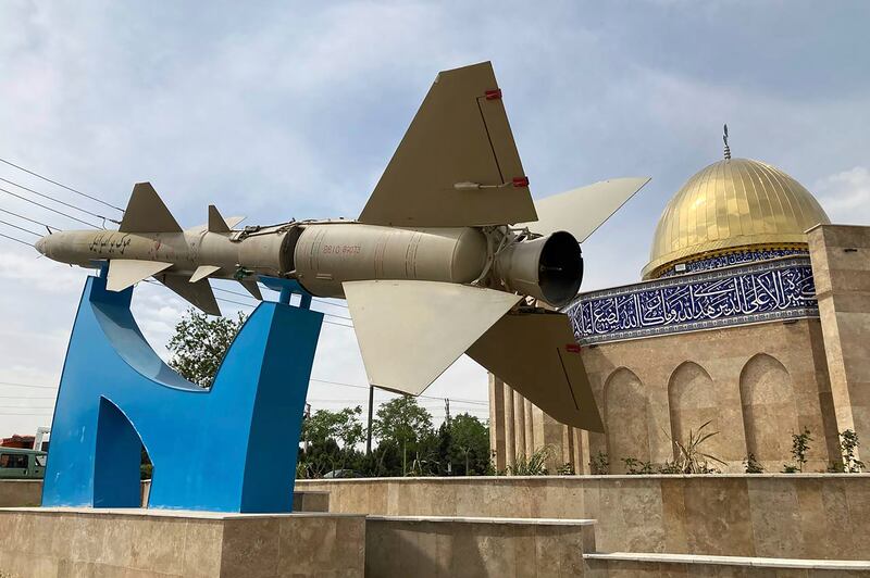 A missile on display with an anti-Israel sign on it in Quds town, west of the Iranian capital Tehran. AP