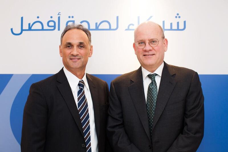 Maher Abouzeid, the president and chief executive for eastern growth markets at GE, and John Flannery, the president and chief executive of GE Healthcare during the Arab Health conference in Dubai. Anna Nielsen for the National