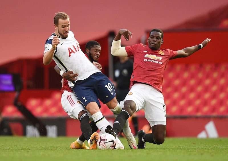 Spurs' Harry Kane battles for possession with Paul Pogba of United. Reuters