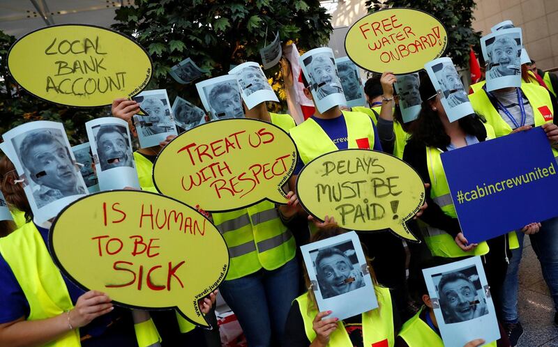 Employees of Ryanair wear masks of O'Leary as they protest at Fraport airport in Frankfurt, Germany. Reuters