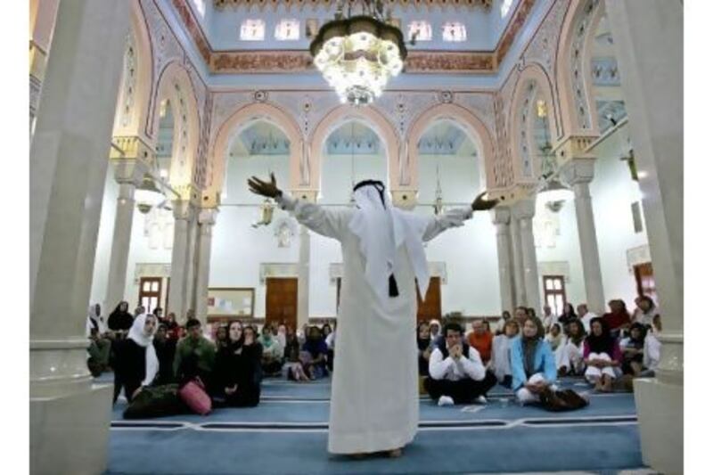 A talk about Islam, for non-Muslims visiting a Dubai mosque. Opportunities for expatriates to learn about the country and its people are common, readers say, rejecting poll findings that said the UAE is unwelcoming. Kamran Jebreili / AP
