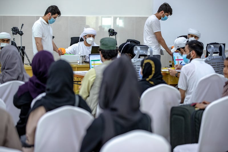 Evacuees wait to be processed at the humanitarian camp just outside Abu Dhabi.