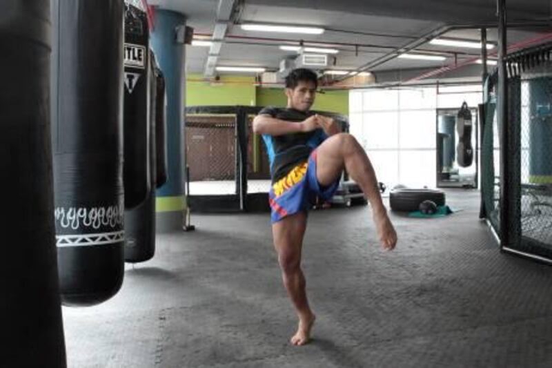 Dubai, United Arab Emirates - December 12, 2012.  George Lusadan ( Ex Professional Thai Boxing fighter ) shows knee strike move, like this forward step.  ( Jeffrey E Biteng / The National )