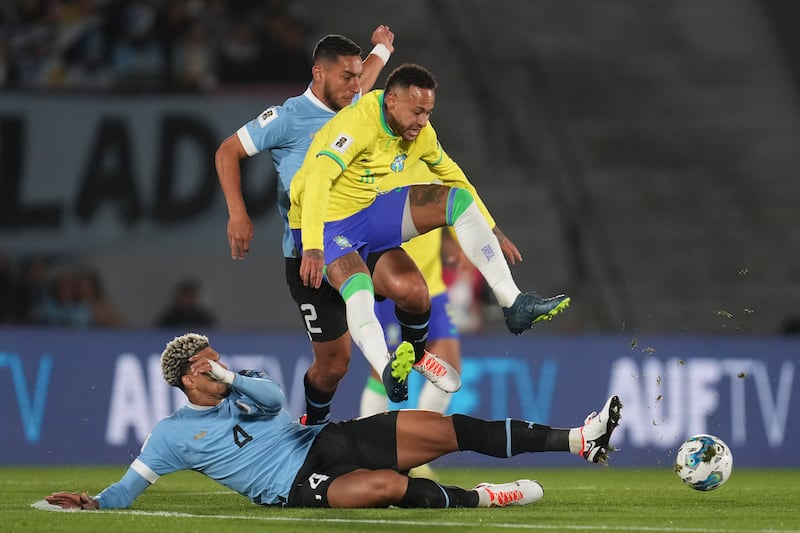 Neymar is tackled by Ronald Araujo during a Fifa World Cup 2026 qualifying match at Centenario stadium between Brazil and Uruguay. AP