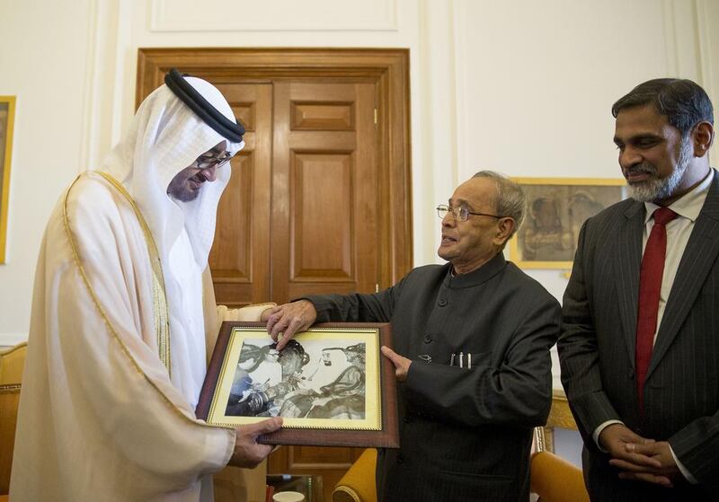 Sheikh Mohammed bin Zayed, Crown Prince of Abu Dhabi and Deputy Supreme Commander of the Armed Forces receives a photograph from Pranab Mukherjee President of India after conducting a meeting at Rashtrapati Bhavan. Mohamed Al Hammadi / Crown Prince Court — Abu Dhabi