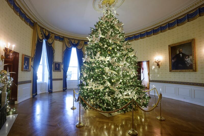 The official White House Christmas Tree with the theme of 'The Gift of Peace and Unity' stands in the Blue Room. Reuters