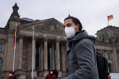 Tareq Alaows, who is running to become a lawmaker at the German parliament Bundestag arrives for a demonstration against the deportation of refugees at the Reichstag building in Berlin, Germany, Saturday, Feb. 6, 2021. Tareq Alaows fled the civil war in Syria in 2015, crossed the Mediterranean on a flimsy rubber boat and tracked up the Balkans, like over a million migrants looking for a save haven in Germany. Five years on, the 31-year-old Syrian has received asylum, speaks fluent German, has a job, applied for citizenship and launched his campaign to run for federal elections in Germany on Sept. 26, 2021. (AP Photo/Markus Schreiber)