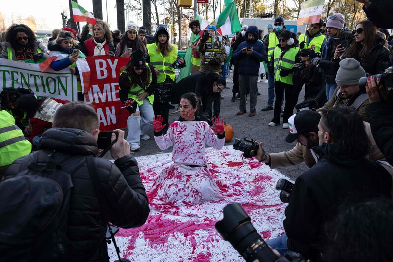 Naz Gharai, from Tehran, is covered in red paint as protesters call on the UN to take action over the treatment of women in Iran. Last month, the EU issued sanctions against several Iranian institutions and individuals over Tehran's crackdown on protesters. AFP