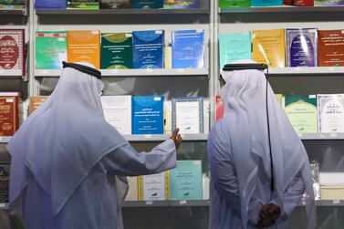 People attend the Sharjah International Book Fair in the Gulf emirate of Sharjah, on November 7, 2021.  (Photo by Giuseppe CACACE  /  AFP)
