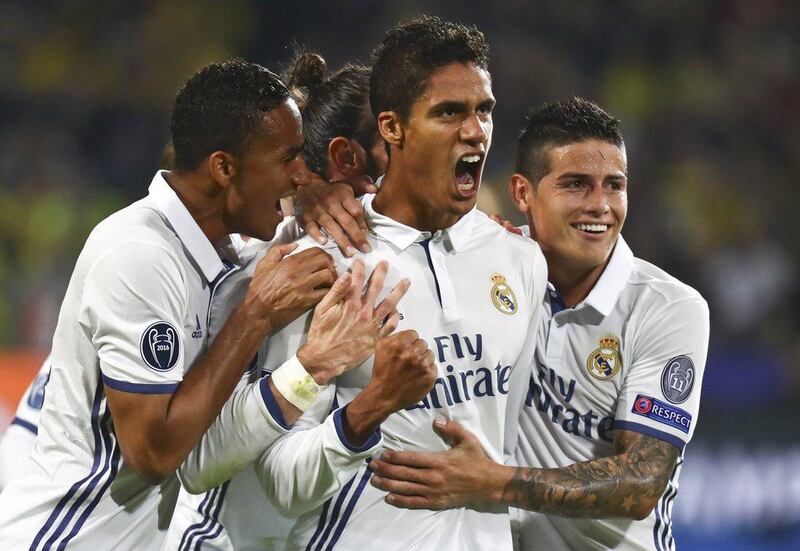 Real Madrid’s Raphael Varane reacts with teammates after scoring. Kai Pfaffenbach / Reuters