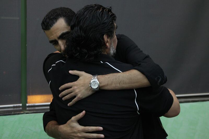 Tariq Al-Sharabi gives his condolonces to Diego after the death of his mother. Courtesy Tariq Al-Sharabi