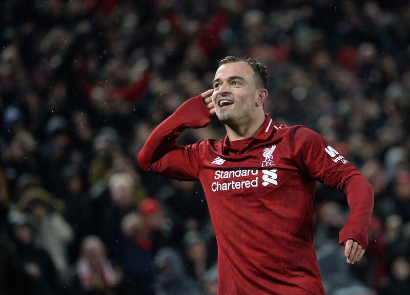 epa07236059 Xherdan Shaqiri of Liverpool celebrates after scoring the 3-1 goal during the English Premier League soccer match between Liverpool FC and Manchester United FC at Anfield in Liverpool, Britain, 16 December 2018.  EPA/PETER POWELL EDITORIAL USE ONLY. No use with unauthorized audio, video, data, fixture lists, club/league logos or 'live' services. Online in-match use limited to 120 images, no video emulation. No use in betting, games or single club/league/player publications.