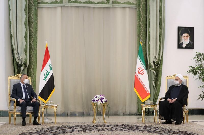 Iraqi Prime Minister Mustafa Al Kadhimi, left, meets Iranian President Hassan Rouhani in Tehran, Iran.  Reuters