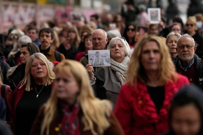 Bereaved families travelled to the wall from across the country to mark the day, with a petition to make the wall a permanent memorial.  AP Photo